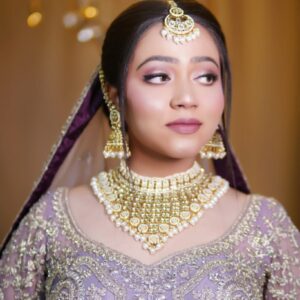 Professional makeup artist applying flawless bridal makeup using premium products, highlighting the importance of hiring a professional makeup expert for a perfect look.| NS MAKEUP STUDIO