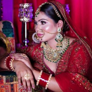 Airbrush makeup artist applying flawless foundation with an airbrush machine, comparing HD and airbrush makeup techniques for a smooth bridal finish. | NS MAKEUP STUDIO